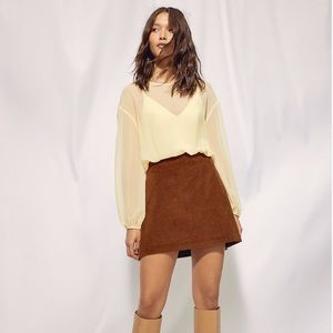 Pale yellow bodysuit blouse